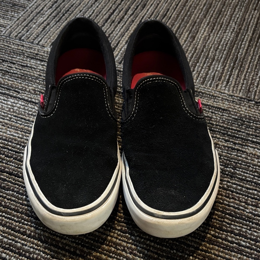 Vans Black and White Slip-On Sneakers
